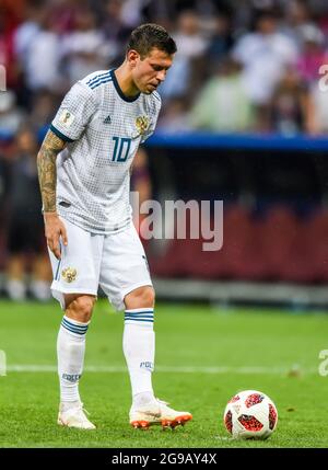 Moscow, Russia - July 1, 2018. Russian national football team striker Fedor Smolov preparing to perform a penalty kick during penalty shootout in FIFA Stock Photo