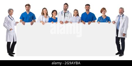 Full length portrait of confident multiethnic medical doctors team holding blank billboard isolated on white background, copy space for text Stock Photo