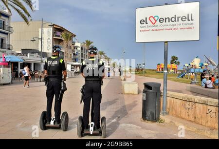 Vendrell, Spain. 23rd July, 2021. Local Police of Vendrell patrol on Sagway electric vehicles. The Local Police of El Vendrell (Spain) incorporates the segway into its vehicle fleets, the one-person transport system that allows greater agility to the police officer and control capacity in pedestrian areas closed to traffic or crowded areas of people and commercial areas. These vehicles reach 20 km/hour, they are electrical equipment, so they do not generate noise or polluting emissions. (Photo by Ramon Costa/SOPA Images/Sipa USA) Credit: Sipa USA/Alamy Live News Stock Photo