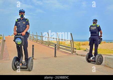 Vendrell, Spain. 23rd July, 2021. Local Police of Vendrell patrol on Sagway electric vehicles. The Local Police of El Vendrell (Spain) incorporates the segway into its vehicle fleets, the one-person transport system that allows greater agility to the police officer and control capacity in pedestrian areas closed to traffic or crowded areas of people and commercial areas. These vehicles reach 20 km/hour, they are electrical equipment, so they do not generate noise or polluting emissions. (Photo by Ramon Costa/SOPA Images/Sipa USA) Credit: Sipa USA/Alamy Live News Stock Photo