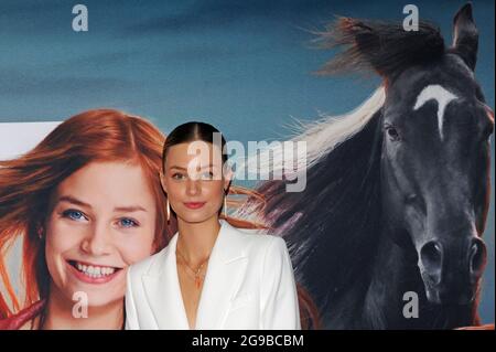 Munich, Germany. 25th July, 2021. The actress Hanna Binke comes to the premiere of her feature film 'Ostwind - Der große Orkan' at the Mathäser cinema. The theatrical release is on 29.07.2021. Credit: Ursula Düren/dpa/Alamy Live News Stock Photo