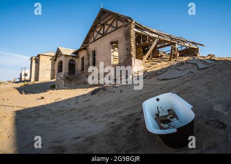 Abandoned buildings in Kolmanskop, a ghost town near Luderitz in the Namib Desert, Namibia, southwest Africa. Stock Photo