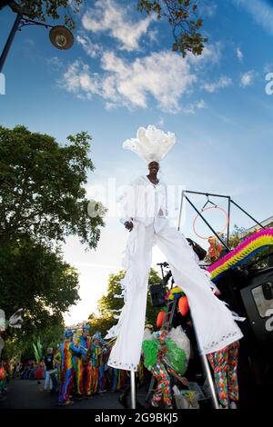 River Thames festival -  performer Stilt walking on the streets along river Thames, London - UK. Stock Photo