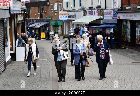 Ladies out shopping wearing Covid facemasks facemask in the main shopping street of Wellington, Telford, Shropshire, face mask masks coronavirus covid Stock Photo