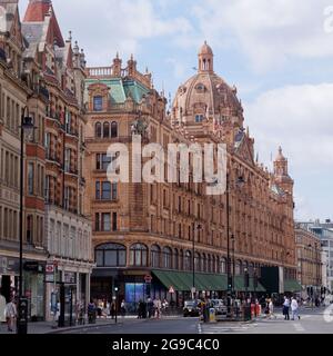 London, Greater London, England, June 12 2021: Harrods department store with its elegant exterior and dome on the roof on Brompton Road . Stock Photo