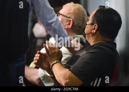 San Salvador, El Salvador. 25th July, 2021. Former Minister of Labor CALIXTO MEJIA gestures while cuffed. Former government officials from the FMLN (Frente Farabundo MartÃ- para la LiberaciÃ³n Nacional) where accused of corruption by the Attorney's office. The FMLN and social organizations have called this a first political imprisonment as due process and constitutional guarantees were not granted. (Credit Image: © Camilo Freedman/ZUMA Press Wire) Stock Photo