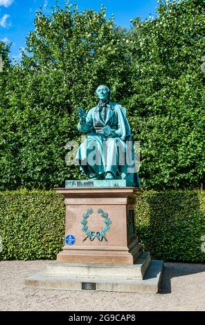 Statue of the Danish writer Hans Christian Andersen in the park of Rosenborg Castle, built in the Dutch Renaissance style in the 17th century. Stock Photo