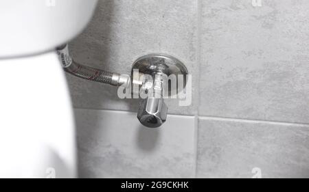 Toilet pipes close-up, plumbing concept background for bathroom Stock Photo