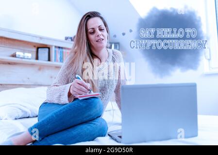 Conceptual caption Say Hello To Cryptocurrency. Internet Concept Lead and advertise decentralized money exchange Casual Internet Surfing, Student Stock Photo