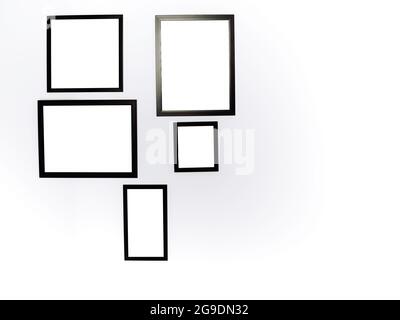 Group of mockup photo frames. White square picture with black frame mockup hanging on the white wall background with copy space. Stock Photo