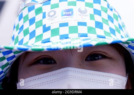 A member of staff at a bus terminal on the third day of the Tokyo 2020 Olympic Games in Japan. Picture date: Monday July 26, 2021. Stock Photo