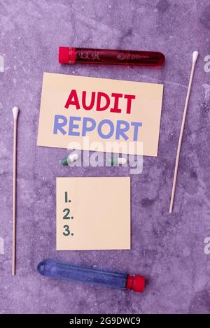 Sign displaying Audit Report. Word for An appraisal of complete financial status of a business Assets Writing Prescription Medicine Laboratory Testing Stock Photo