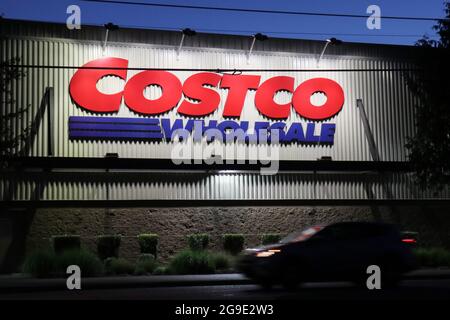 Seattle, United States. 24th July, 2021. A car passes by a Costco store in Seattle. The American big box retailer is opening new locations in the United States and internationally. Credit: SOPA Images Limited/Alamy Live News Stock Photo