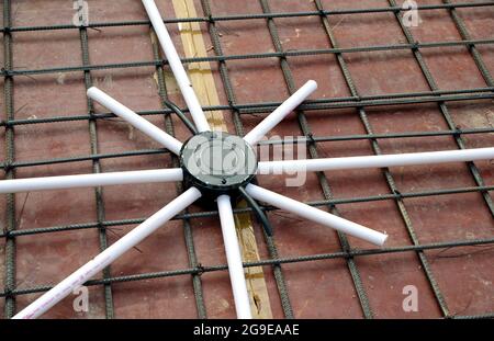 Electric fixture installation during flat construction Stock Photo