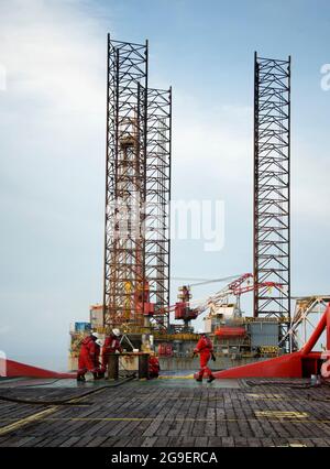 marine crew working on deck during cargo handling operation for jack up rig at sea