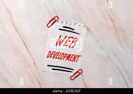 Hand writing sign Web Development. Word Written on work involved in developing a website for the Internet New Ideas Fresh Concept Creative Stock Photo