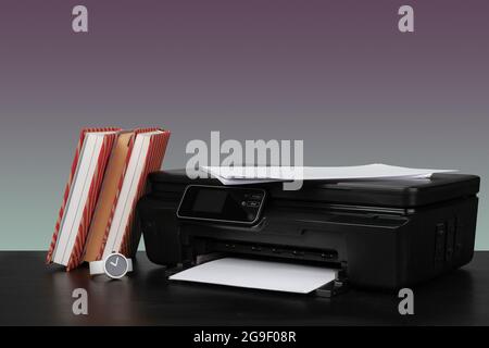 Compact home laser printer against gray background Stock Photo
