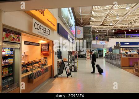 BIRMINGHAM, UK - APRIL 24, 2013: Travelers visit Birmingham International Airport, UK. With 8.9 million travelers served it was the 7th busiest UK air Stock Photo