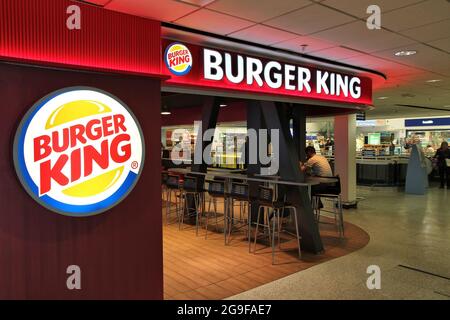 BIRMINGHAM, UK - APRIL 24, 2013: Travelers visit Burger King at Birmingham International Airport, UK. With 8.9 million travelers served it was the 7th Stock Photo