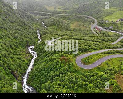 Norway road drone view. Old Austmannalia twisting mountain road in Haukeli Mountains. Stock Photo