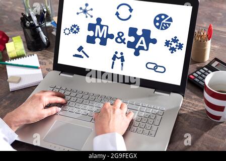 M&a concept shown on a laptop screen Stock Photo