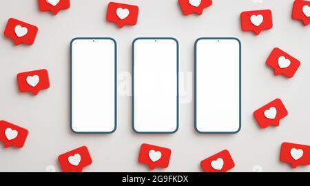 Three blank screen phone mock up surrounded by social network likes. Cellphone display in flat lay view with social network heart button, realistic pr Stock Photo
