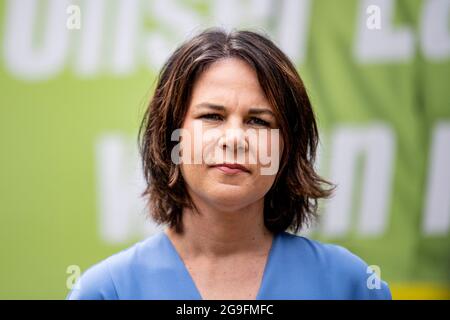 Michendorf, Germany. 26th July, 2021. Annalena Baerbock (Bündnis 90/Die Grünen), party leader and candidate for chancellor, at the unveiling of a large-scale Green poster. With this, the Greens set the starting signal for the nationwide billboarding for the Bundestag election 2021. The Green Party Chairwoman is running in the electoral district 61 Potsdam - Potsdam-Mittelmark II - Teltow-Fläming II as a direct candidate against, among others, the SPD candidate for chancellor O. Scholz. Credit: Fabian Sommer/dpa/Alamy Live News Stock Photo