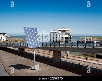 ferry from texel arrives at port of den helder in the netherlands under blue sky on sunny summer day Stock Photo