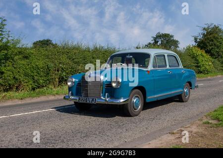 1962 60s blue sixties Mercedes Benz 190 D 1897cc petrol 4dr saloon en-route to Capesthorne Hall classic July vintage car show, Cheshire, UK Stock Photo