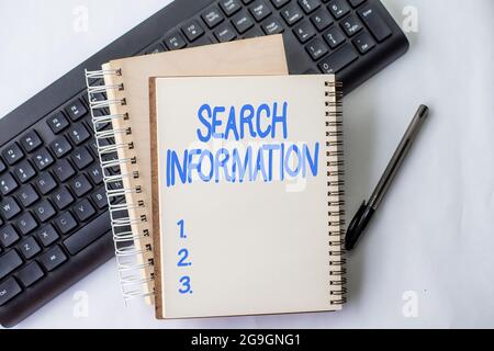 Writing displaying text Search Information. Business showcase the act or process of looking for someone or something Two Plain Lined Spiral Notebooks Stock Photo