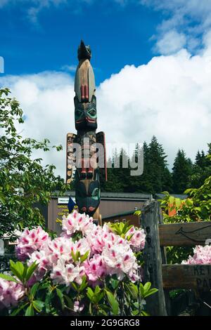 Totem pole on sunny day in Alaska Stock Photo