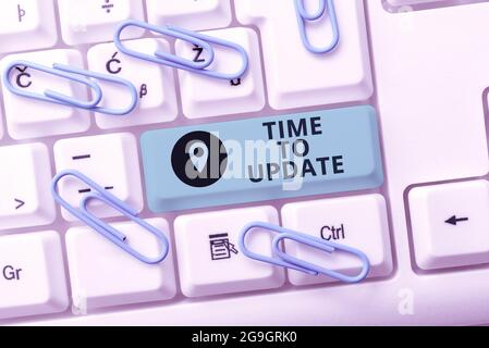 Hand writing sign Time To Update. Word for System software update for enhancement or compatibility Writing Comments On A Social Media Post, Typing Stock Photo