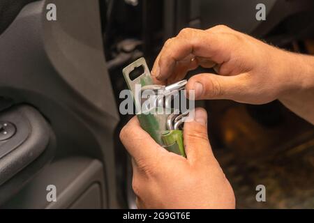 Set of torx screwdrivers in the hands of a male mechanic close-up Stock Photo