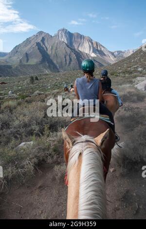 You can ride a horse at the pack station by Convict Lake in Mono County, CA, USA, which gives you wonderful views of the mountains. Stock Photo