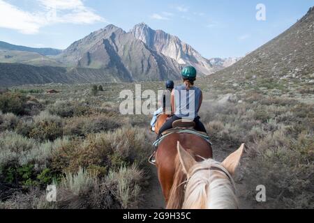 You can ride a horse at the pack station by Convict Lake in Mono County, CA, USA, which gives you wonderful views of the mountains. Stock Photo