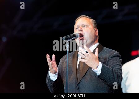 Paul Potts performing on stage in Maldon, Essex, UK. Welsh male ...