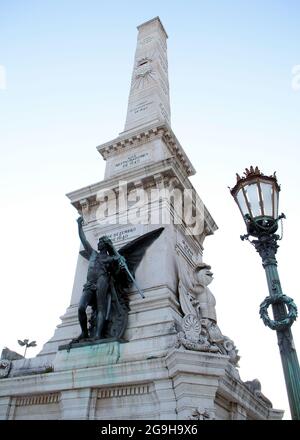 Statue symbolizing Independence at the southern side of the Monument to the Restorers in Restauradores Square, erected in 1886, Lisbon, Portugal Stock Photo