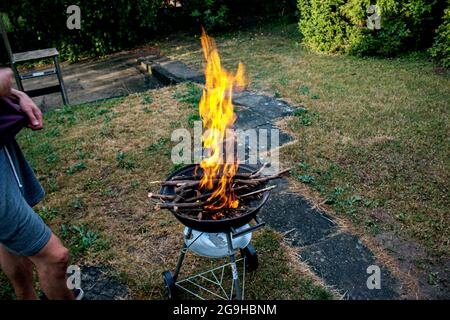 Burning fire, wood, coals for barbecue. Camping BBQ preparation Stock Photo