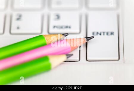 Back to school. Pencils on a computer laptop keyboard. Stock Photo