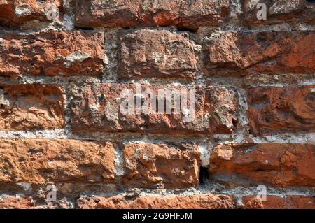 Section of the wall made of old red brick. Background. Stock Photo