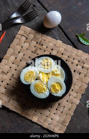 Boiled egg slices on a dish with use of selective focus Stock Photo