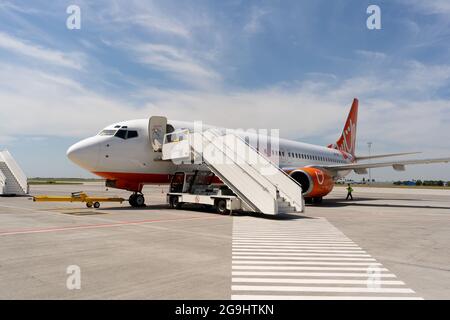 Ukraine, Odessa - July 16, 2021: Passenger aircraft Boeing 737-8Z0 SkyUp Airlines aircraft - UR-SQG at Odessa airport. Travel and flights. Stock Photo