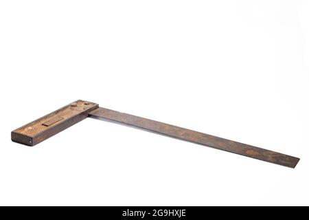 vintage machinist layout square tool over white. an old metal corner ruler isolated. Stock Photo