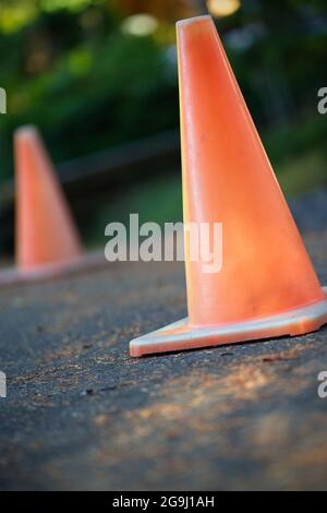 orange traffic cones on street vertical Stock Photo