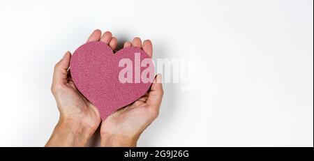 Red paper heart in woman's hands on white background Stock Photo