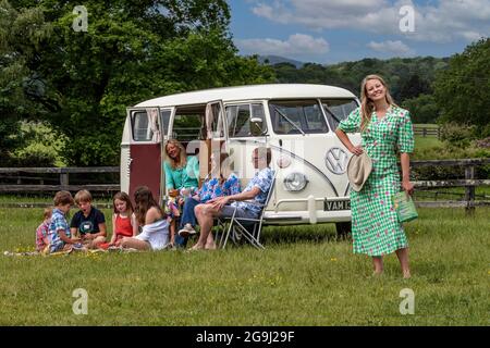 Family at Woodfire Camping near Petworth in West Sussex with a 1966 retro VW campervan, England, United Kingdom Stock Photo