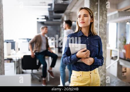 Programmers cooperating at IT company developing apps Stock Photo