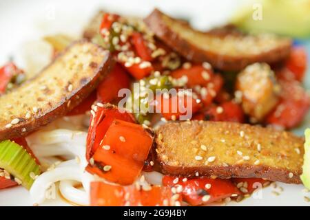 Grilled vegetables and smoked Tofu on a plate with korean noodles, healthy food Stock Photo