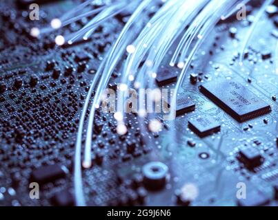 Close-up of fibre optics and computer circuit board Stock Photo