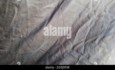 A black color fabric pattern texture background. Close up of beautiful wrinkle black fabric texture Stock Photo